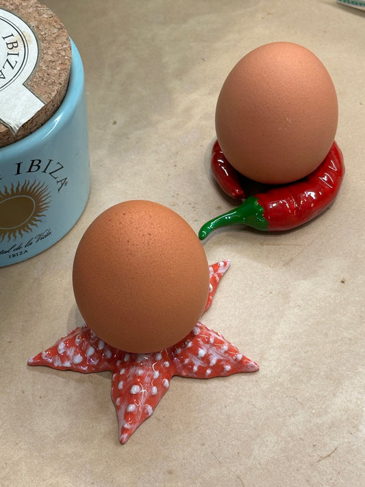 Set van 2 rode peper servetringen / eierdopjes