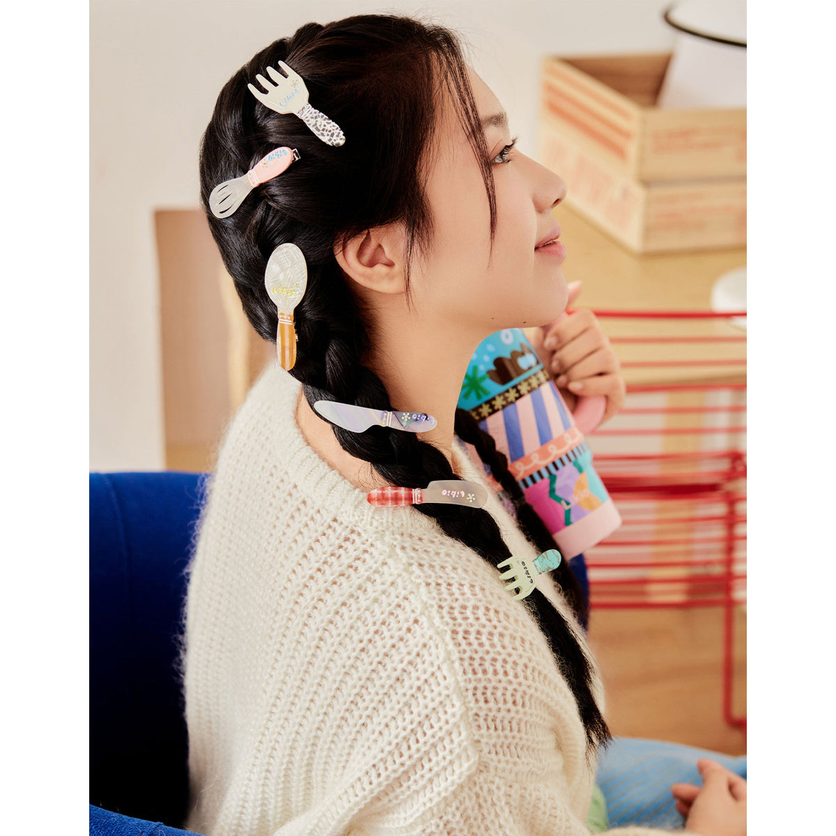 Likio kitchen utensil hair clips worn in two long braids