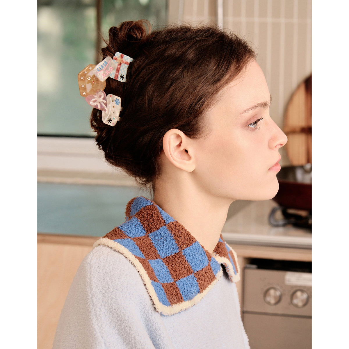 Likio hair claw shaped like a gift in an updo