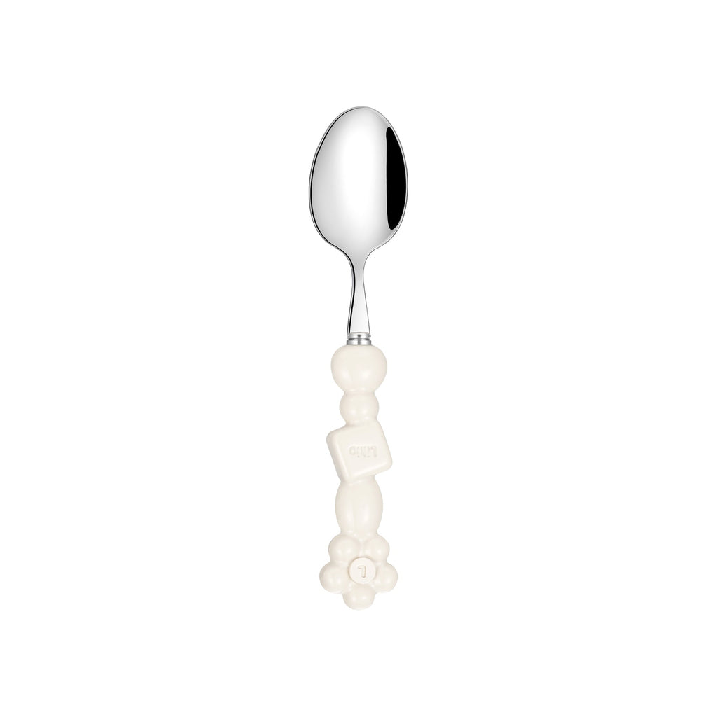 Likio fork and spoons with beads and geometric details on a laid table