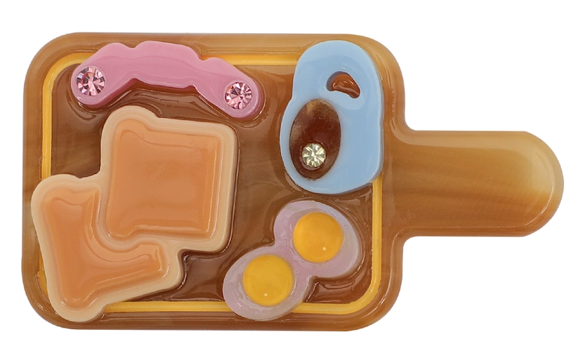 Likio Energy Breakfast hair clip shaped like a breakfast board, front view